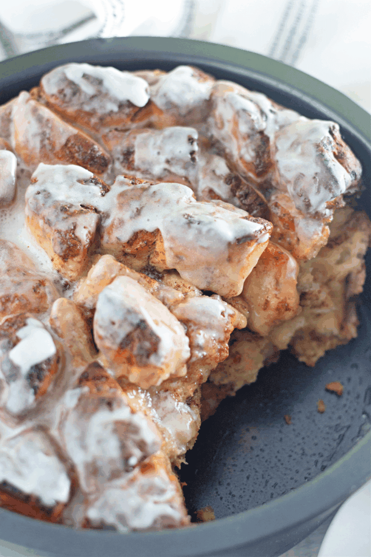 Slice of air fryer cinnamon roll coffee cake served on a plate