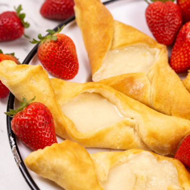 Air fryer cheese danish made with crescent rolls and a sweet cream cheese filling, cooled on a wire rack