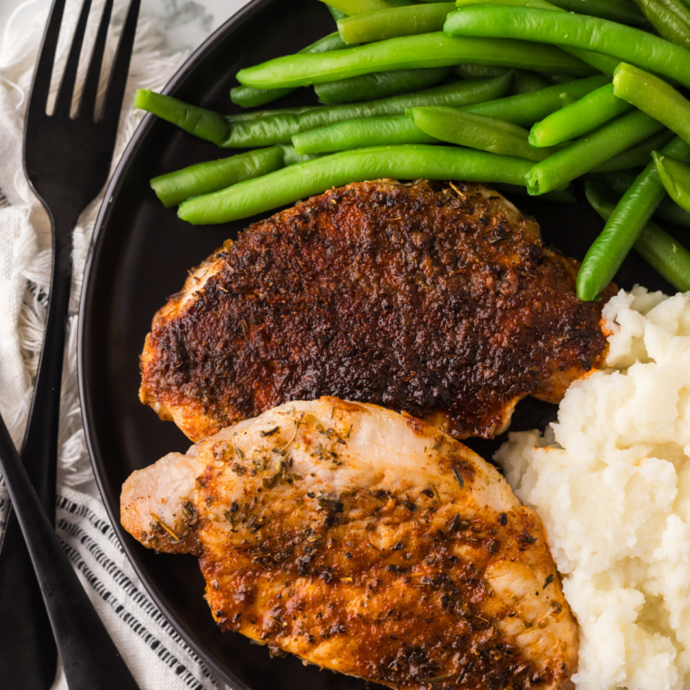Honey garlic pork chops plated with sides for a weeknight dinner