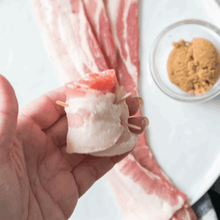 Roll the bacon up, using toothpicks to hold it together.