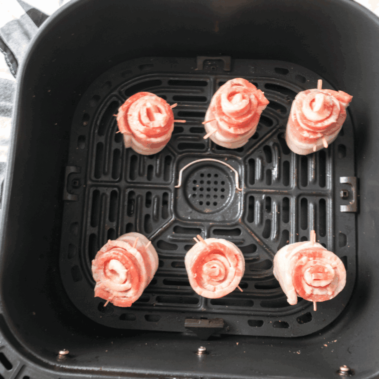 Shaping bacon into roses, glazing with brown sugar and maple syrup, then air frying at 400°F for a crispy, sweet finish.