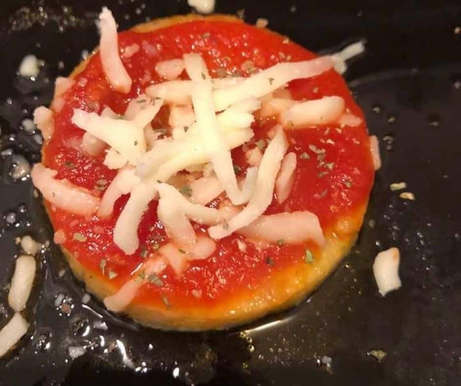 Spread Marinara Sauce on top and shredded mozzarella cheese