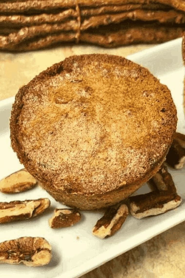 Golden, fluffy air fryer pecan pie muffins topped with chopped pecans
