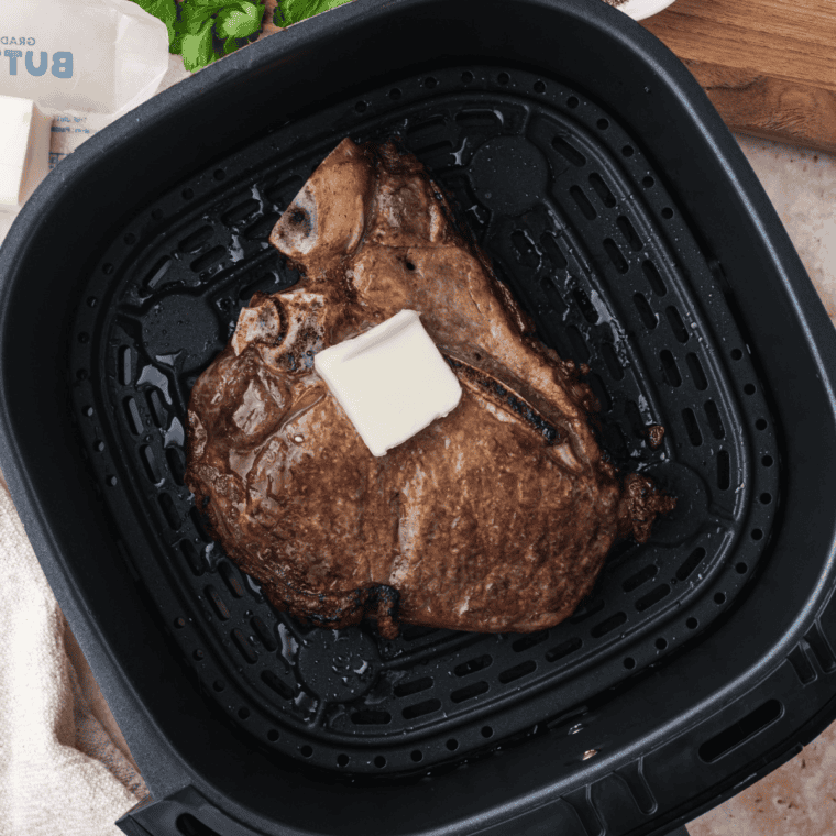 Air Fryer T-Bone Steak with crispy crust and juicy, tender meat topped with Gorgonzola butter.