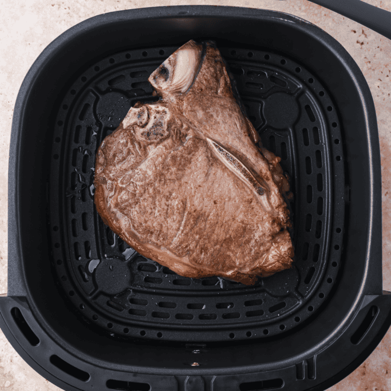 Letting the cooked steaks rest for 4 minutes.