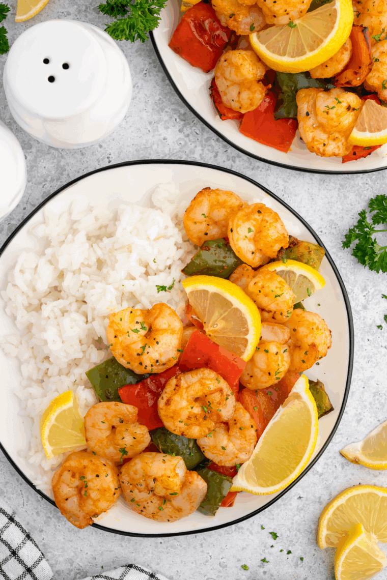 Crispy sweet and sour shrimp cooked in the air fryer, served with tangy sauce over rice