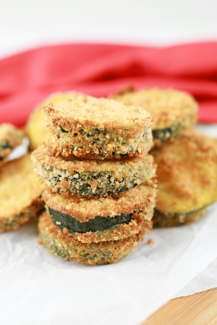 Crispy golden copycat Carl&rsquo;s Jr. fried zucchini sticks served on a plate with dipping sauce.