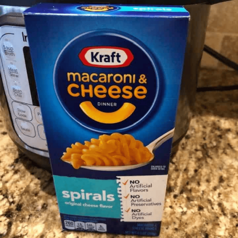 Ingredients needed for Instant Pot Boxed Mac and Cheese (Kraft, Annie&rsquo;s & More!) on kitchen table.