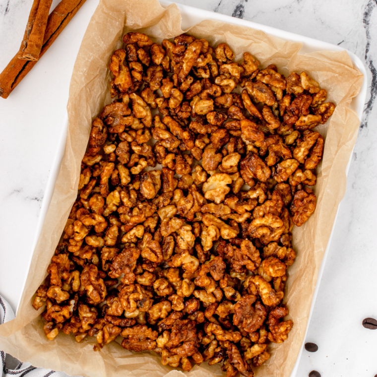 overhead: a baking sheet full of toasted walnuts in air fryer