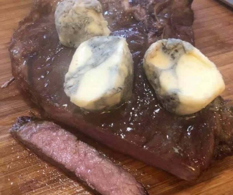 t bone topped with melting gorgonzola butter 