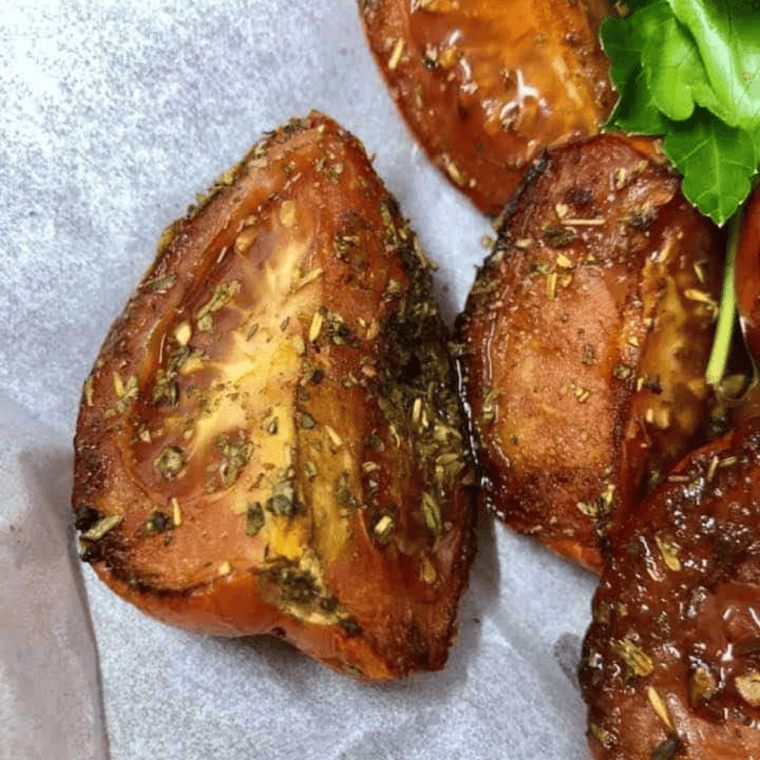 Air fryer balsamic herbed roasted tomatoes seasoned with Italian herbs and balsamic vinegar, perfectly cooked in the air fryer.