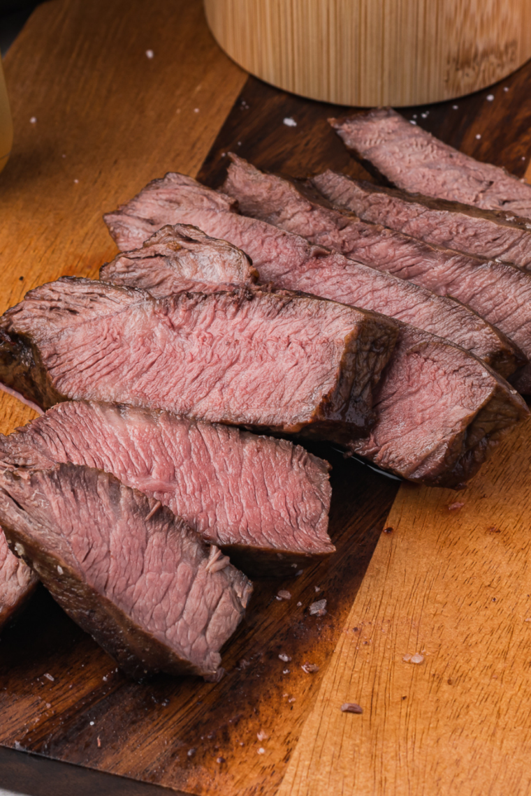 Juicy air fryer flat iron steak sliced and served on plate