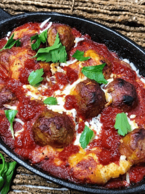 Air fryer meatball bubble up bake with melted mozzarella and marinara in a round pan