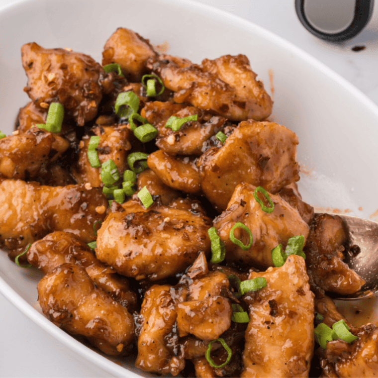 Juicy Copycat Chick-fil-A Grilled Nuggets cooked in an air fryer and served with dipping sauce.