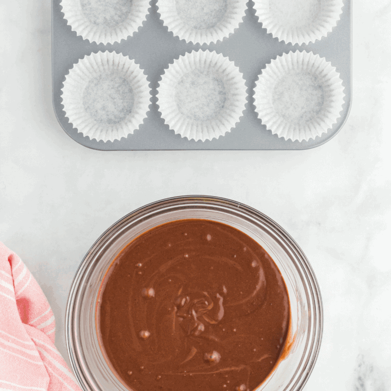 Beating eggs, whole milk, vegetable oil, and vanilla extract in a separate bowl until smooth and well combined.