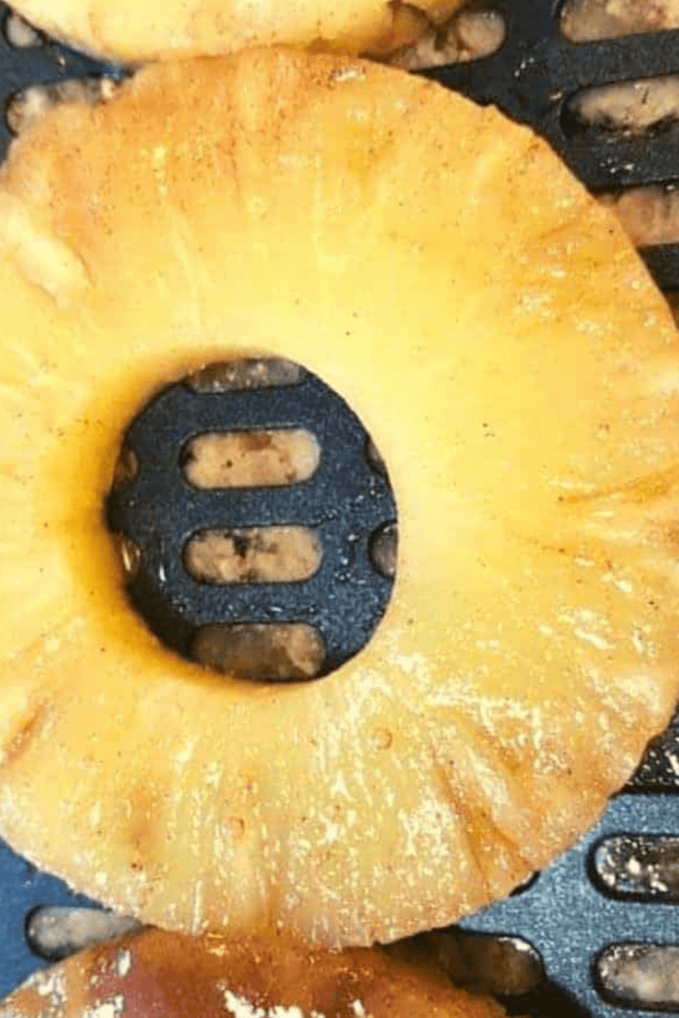 Pineapple rings brushed with melted butter and coated evenly with cinnamon sugar.