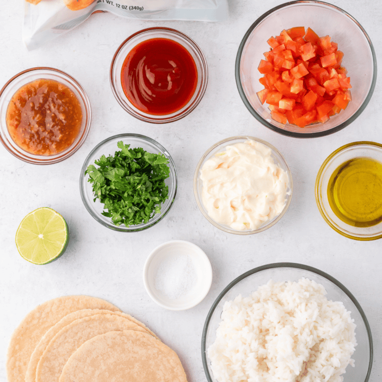 Ingredients needed for Easy Chipotle Chicken and Shrimp Tacos Recipe on kitchen table.