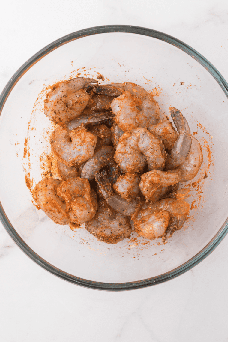 Cooking chipotle-seasoned chicken pieces in a skillet until golden brown and fully cooked.