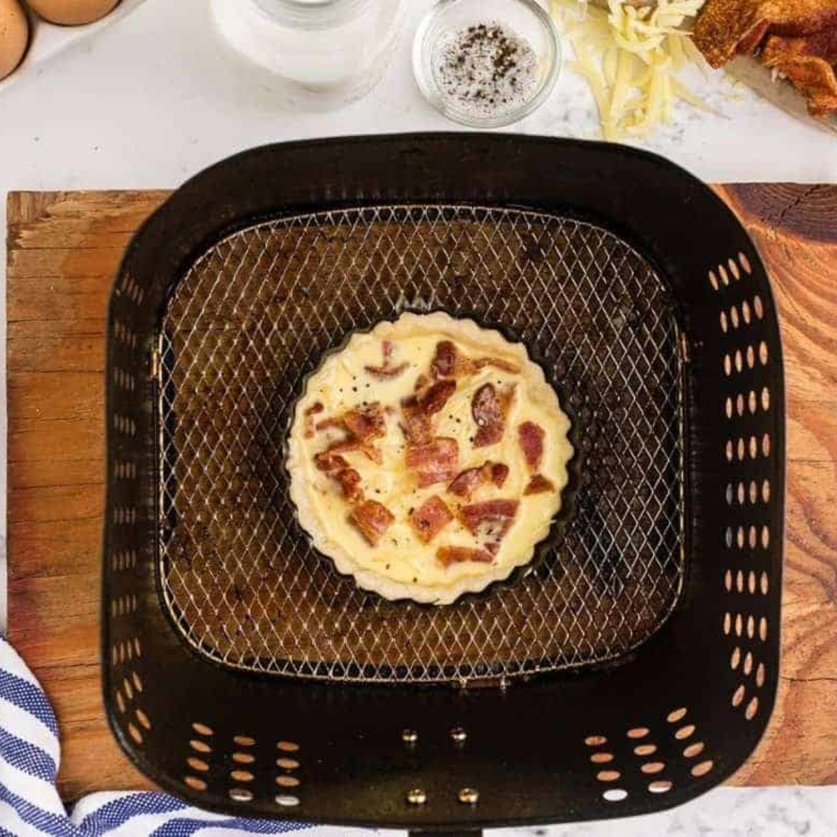 La Madeleine Quiche Lorraine in the air fryer basket.