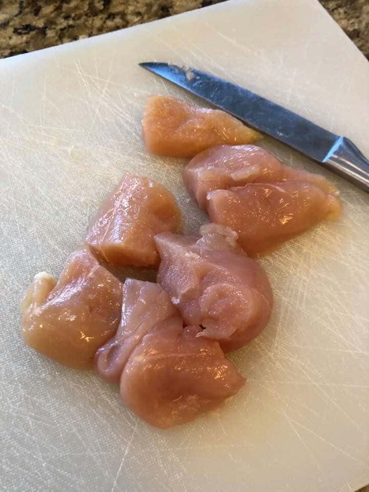 cut chicken on cutting board