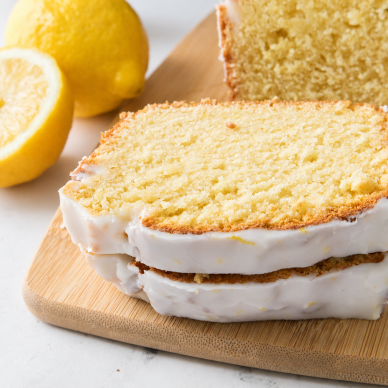 Slice of glazed air fryer lemon loaf showing the tender crumb