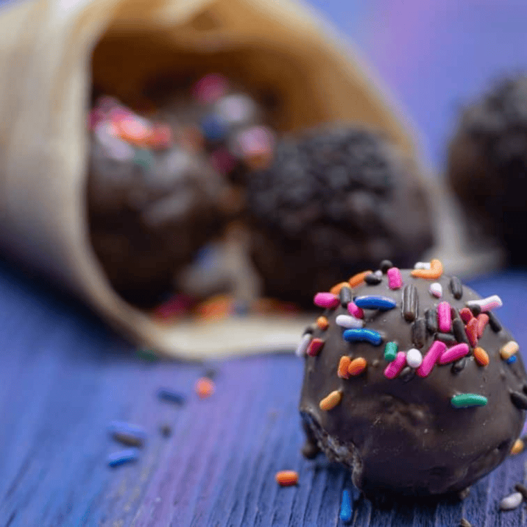 Air Fryer chocolate donut holes cooking to golden perfection.