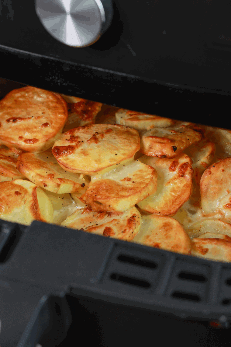 Boxed scalloped potatoes cooked in the air fryer with a golden, crispy top and creamy texture inside.