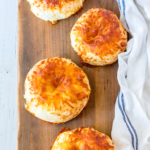 Close-up of Air Fryer Asiago Cheese Bagels – Close-up of golden-brown bagels with a crispy Asiago cheese crust.