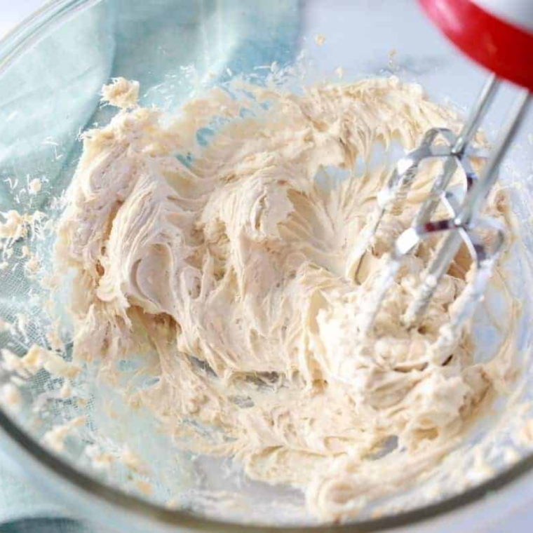 Heavy cream whipped to stiff peaks in chilled mixing bowl
