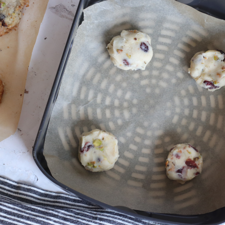 "Placing cookie dough balls in the air fryer basket"