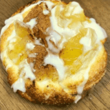 Flaky Air Fryer Crescent Roll Apple Danish with sweet apple filling, dusted with powdered sugar.
