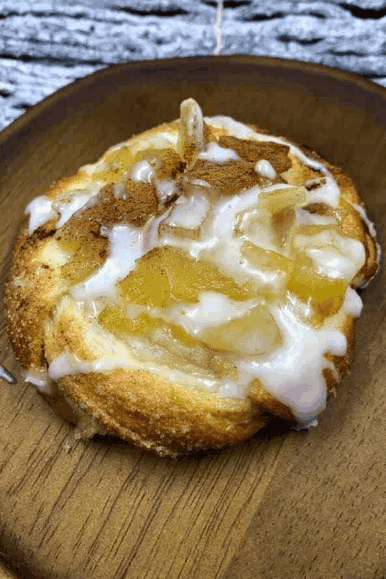 Flaky Air Fryer Crescent Roll Apple Danish with cinnamon-spiced apple filling, golden crust, and powdered sugar topping.