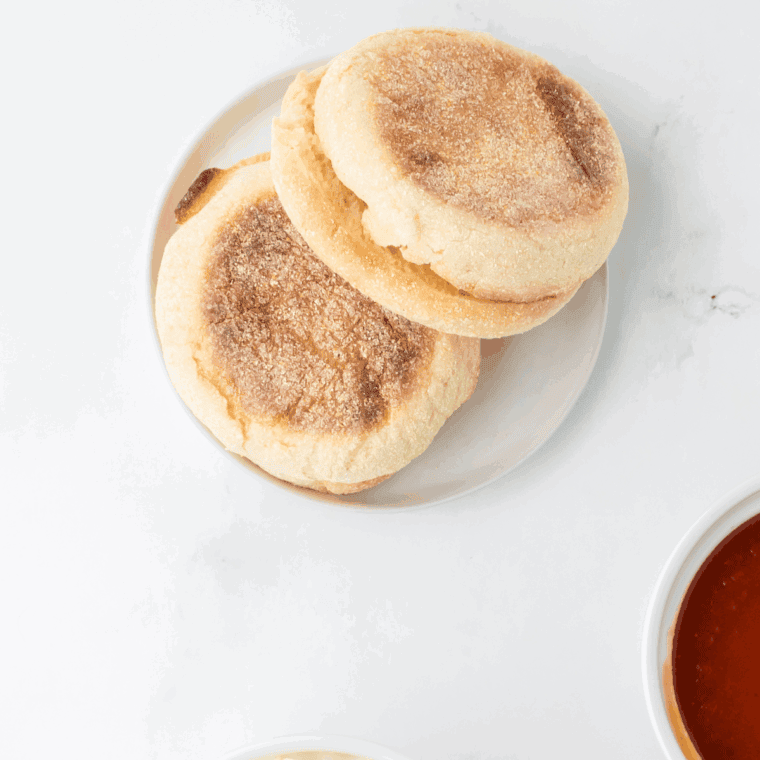 Ingredients needed for Air Fryer English Muffin Breakfast Pizza on kitchen table.