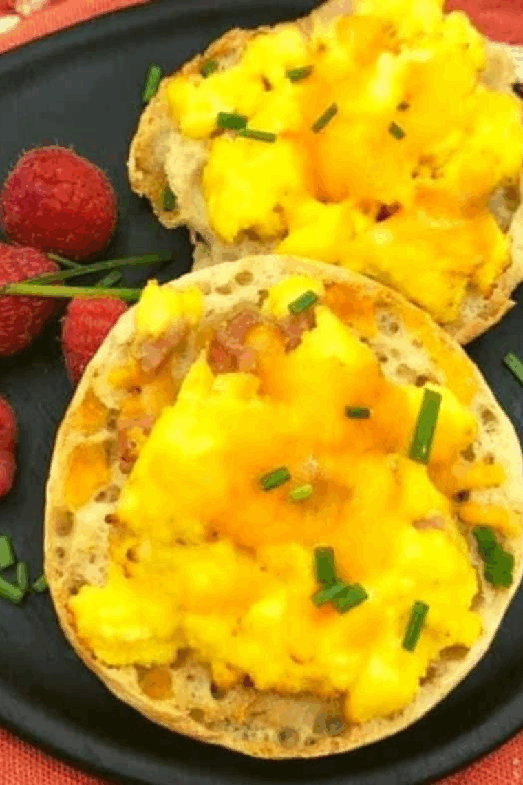 Air Fryer English Muffin Breakfast Pizza topped with egg, cheese, and savory toppings on a golden, crispy muffin base.