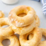 glazed yeast donuts on a blue plate