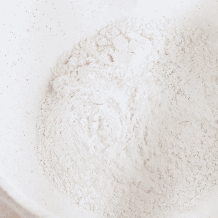 Whisking together flour, baking powder, and salt in a medium bowl.