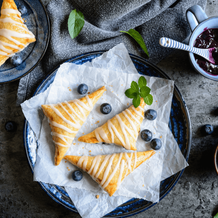 Air Fryer Blueberry Turnovers - Are you looking for an easy and delicious dessert sure to impress? If so, then look no further than these air fryer blueberry turnovers! These air fryer treats are both healthy and indulgent, packed with sweet and tart blueberries, a flaky pastry crust, and a hint of cinnamon sugar. 