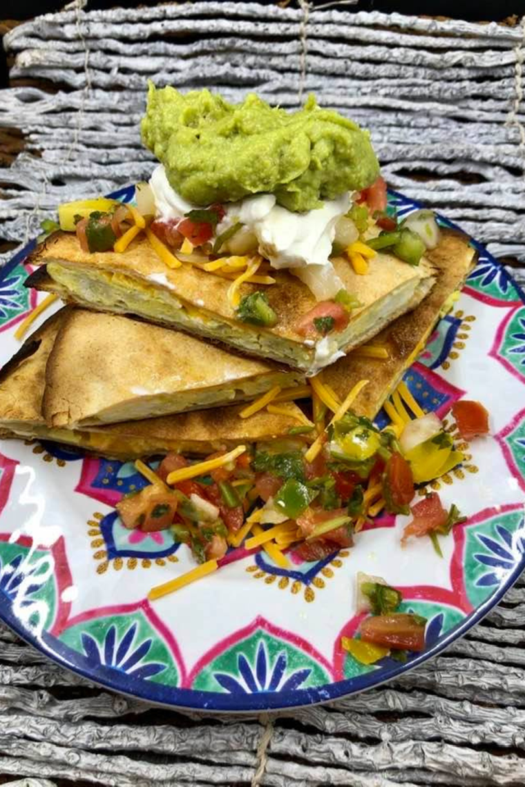 Air Fryer Breakfast Quesadilla with scrambled eggs and cheddar cheese, ready to serve.