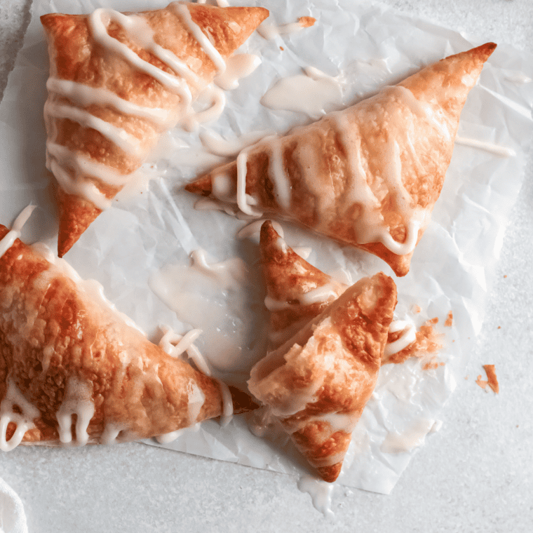 Golden brown air fryer copycat apple pie served on a plate with cinnamon apple filling