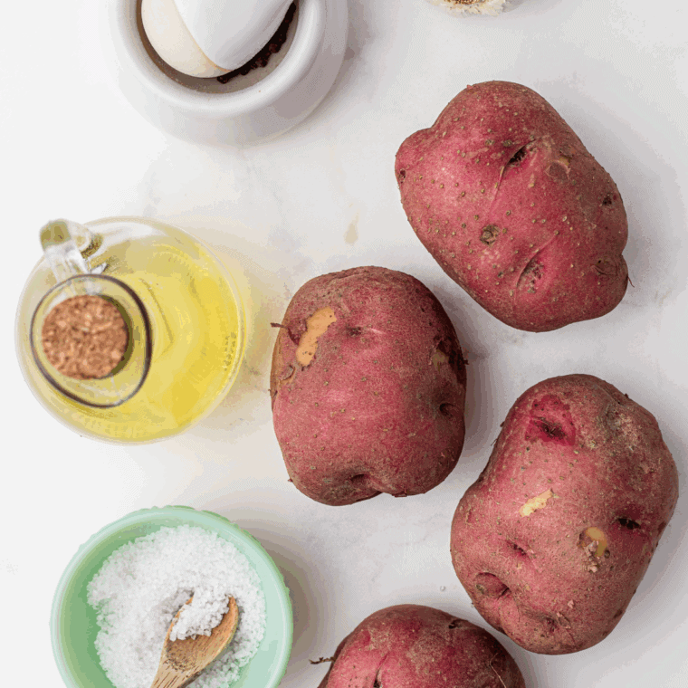 Ingredients needed for Boston Market Garlic Dill Potato Wedges on kitchen table.