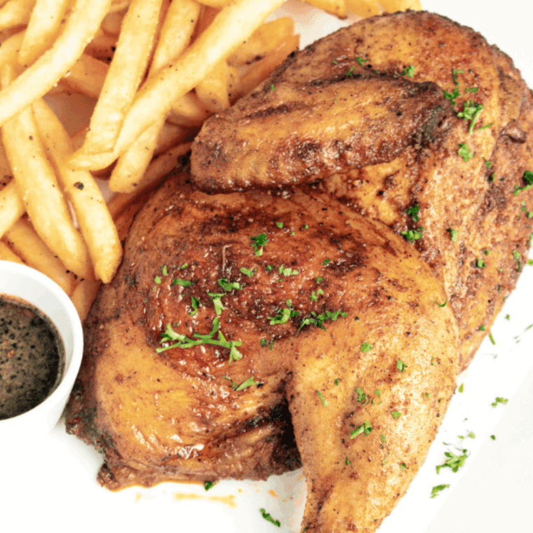 Plate of Cracker Barrel Herb Roasted Chicken Recipe.