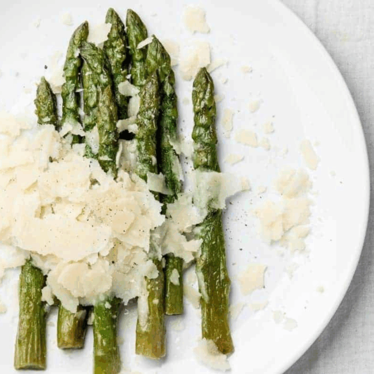 Grilled asparagus seasoned with olive oil, salt, and pepper, served hot