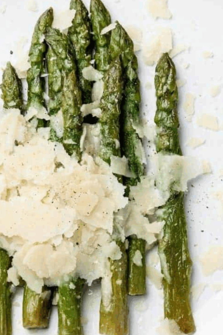 Fresh asparagus spears seasoned and cooked, served as a side dish