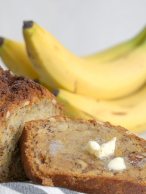 Moist air fryer banana nut bread sliced and served with chopped walnuts on top