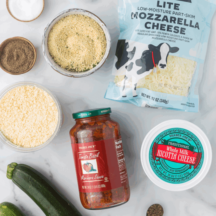 Ingredients needed for Air Fryer Zucchini Pizza Bites on kitchen table.