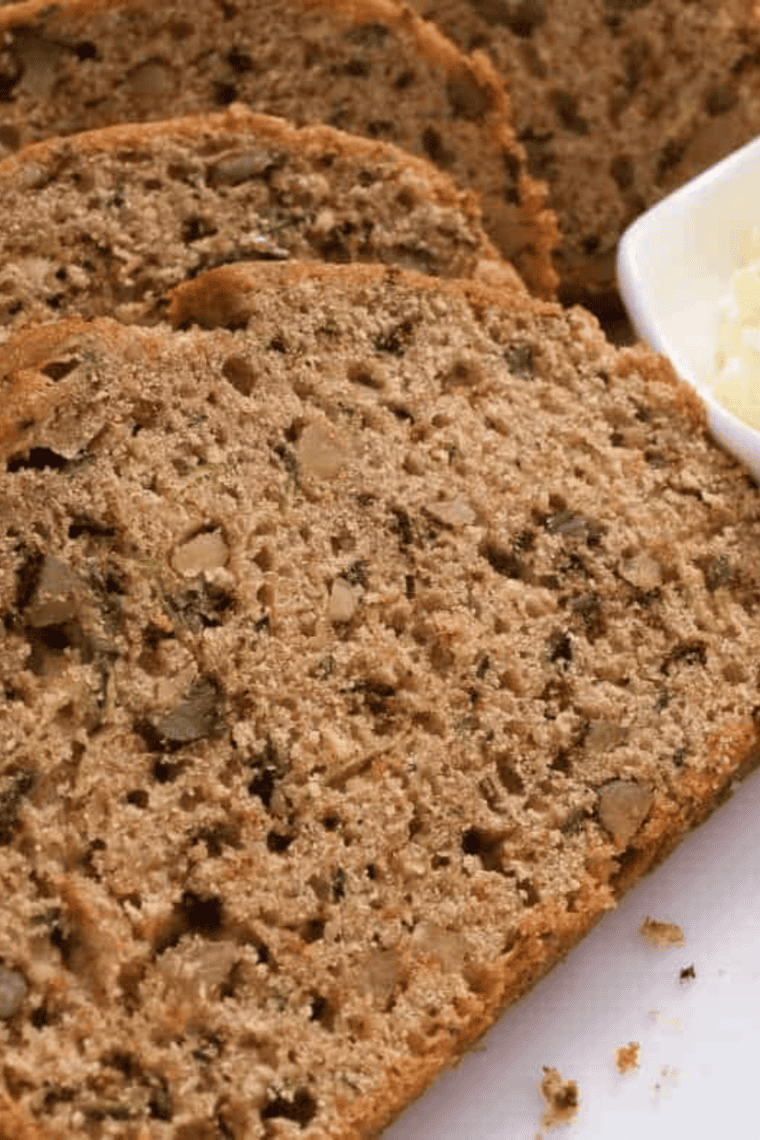 Air Fryer Zucchini Pumpkin Quick Bread loaf with warm spices and walnuts on a cooling rack.