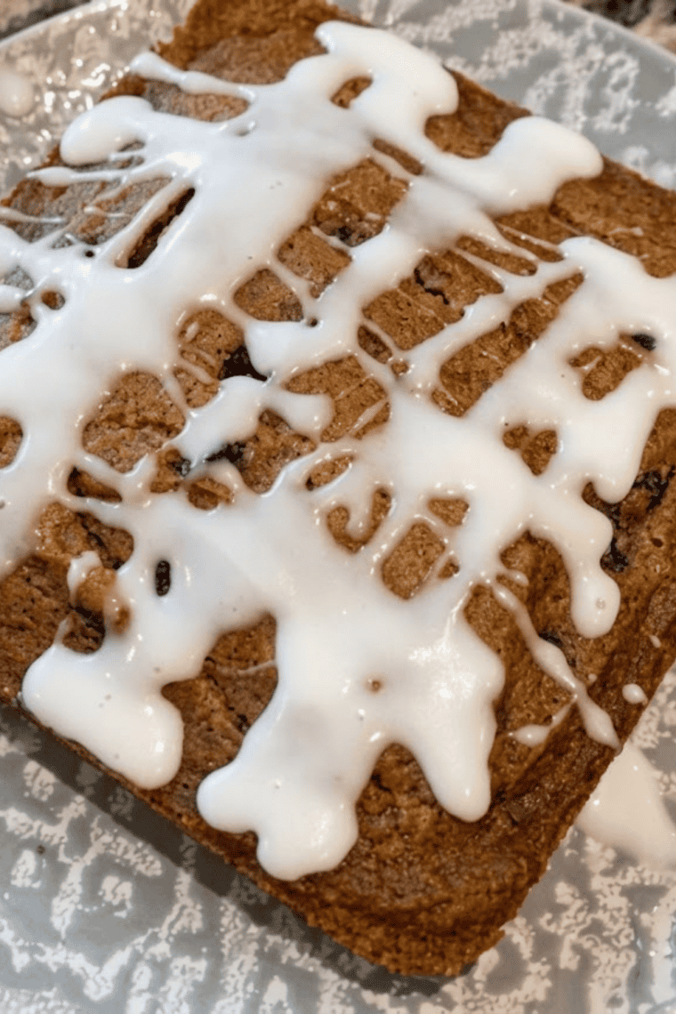 Overhead view of sliced air fryer apple butter bars with glaze drizzle