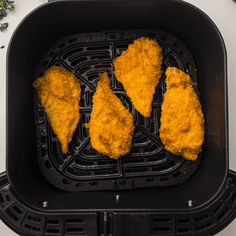 Mayo-coated chicken breast pressed into seasoned panko bread crumbs for a crispy air fryer coating
