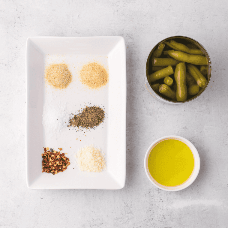 Ingredients needed for Air Fryer Canned Green Beans on kitchen table.