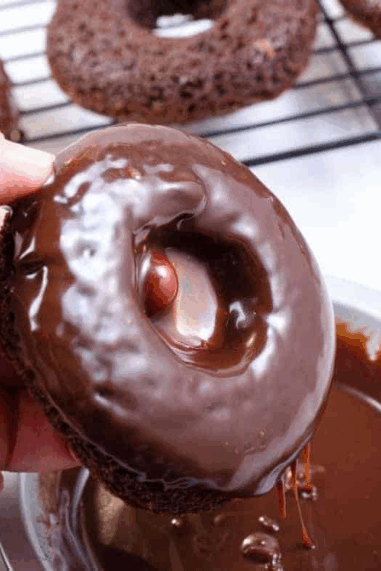 Golden air fryer chocolate cake mix donuts on a plate, ready to serve.
